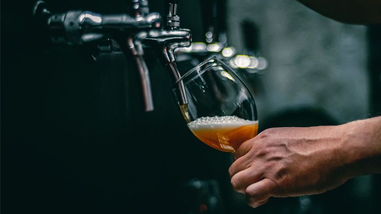 Pouring beer from tap