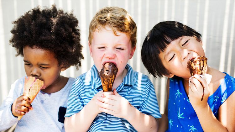 Children enjoying ice cream on a summer day